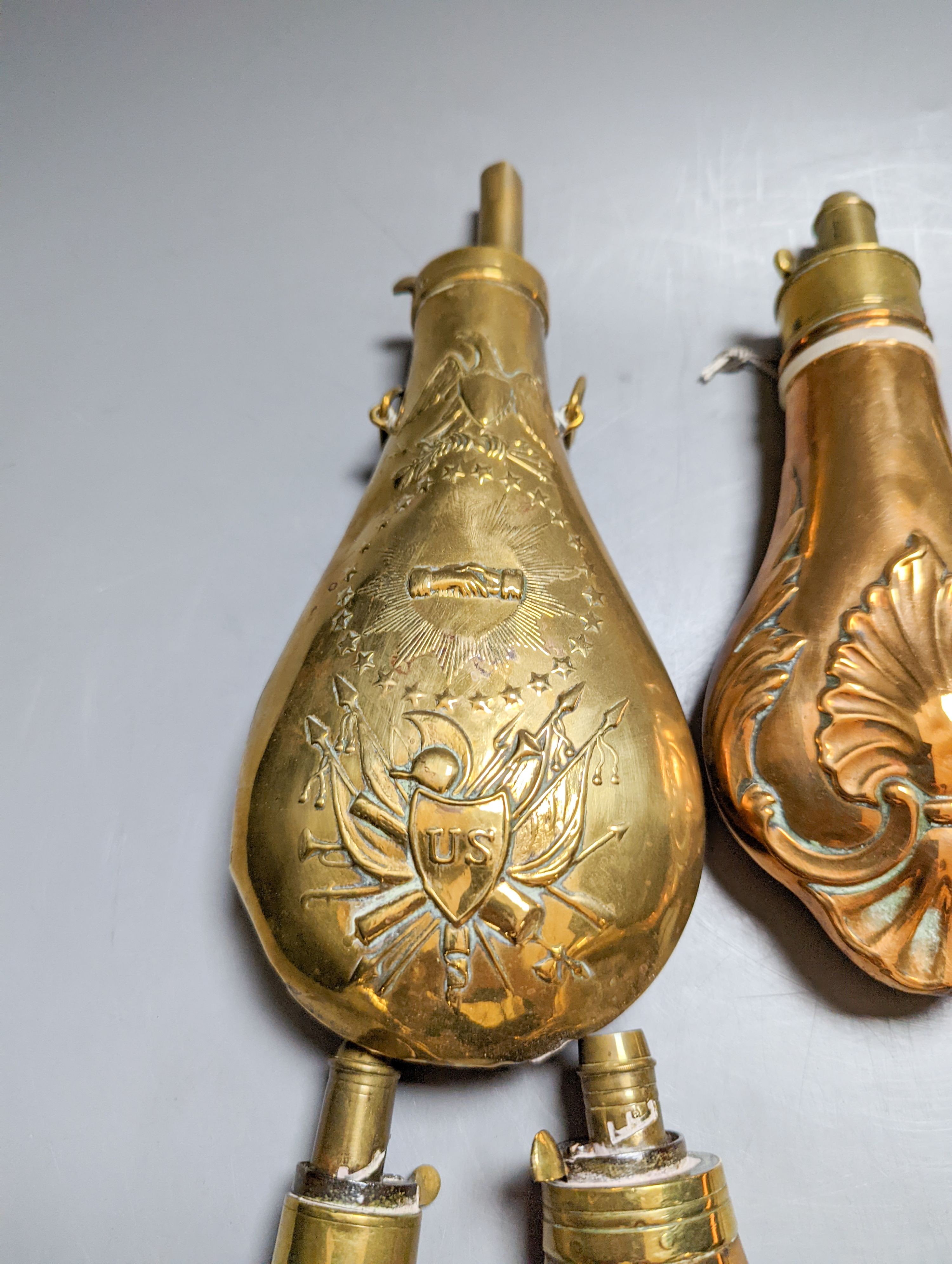 Eight assorted 19th century copper shot flasks